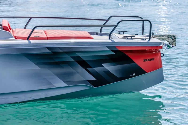 Slide: The Image of 2024 BRABUS SHADOW 300 CT boat on water, sleek design with red and black accents. - 4