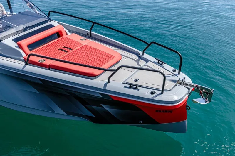 Slide: The Image of 2024 BRABUS SHADOW 300 CT boat with red deck on clear water. - 6