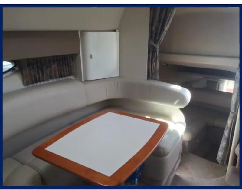 Slide: The Image of Interior of 2000 Formula 31 PC boat with seating and table. - 11