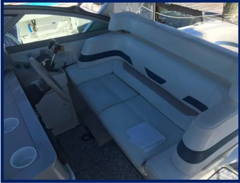 Slide: The Image of 2000 Formula 31 PC boat interior with white leather seating. - 13