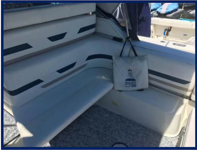 Slide: The Image of Interior seating area of a 2000 Formula 31 PC boat with nautical-themed decor. - 17