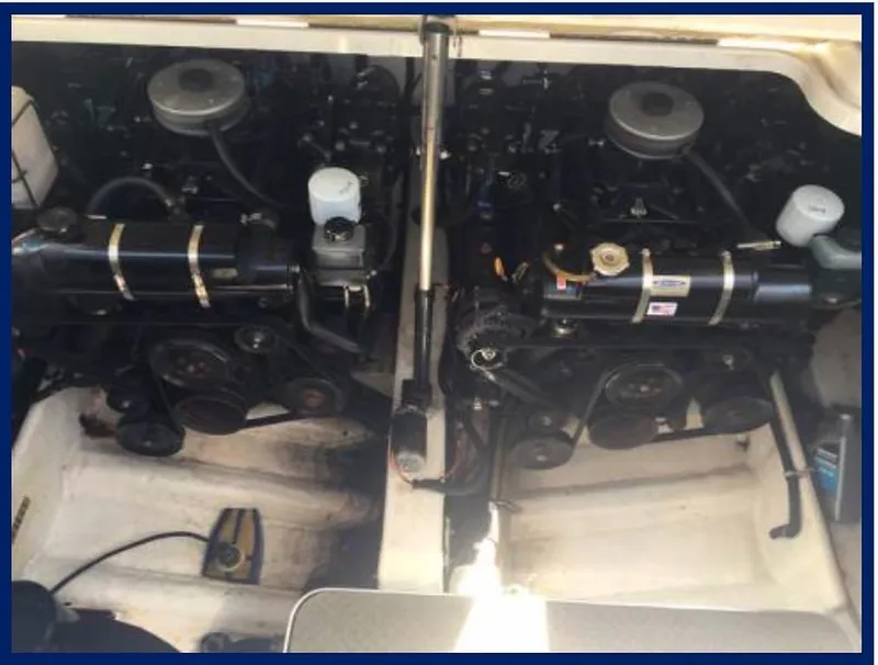 Slide: The Image of Twin engines of a 2000 Formula 31 PC boat in the engine compartment. - 19
