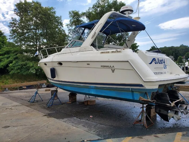 Slide: The Image of 2000 Formula 31 PC boat on stands for maintenance. - 3