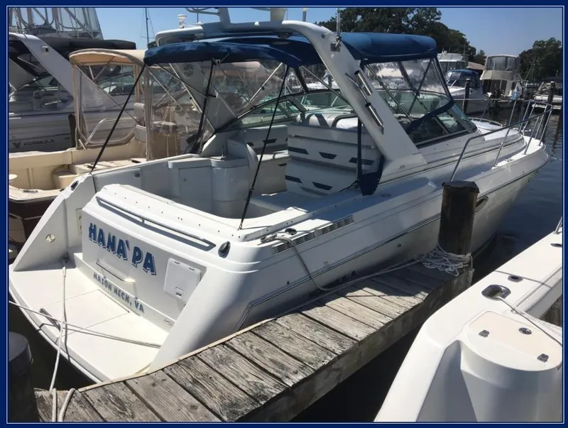 Slide: The Image of 2000 Formula 31 PC boat docked at a marina. - 4