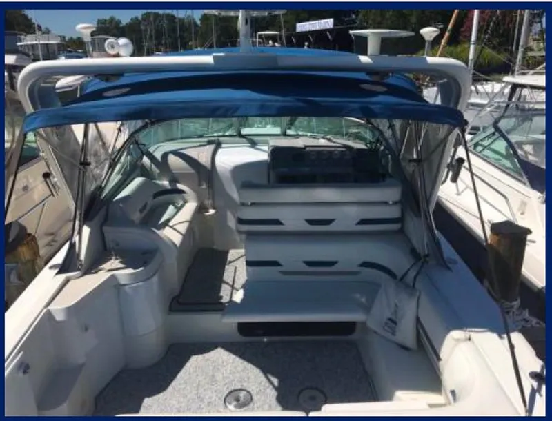 Slide: The Image of 2000 Formula 31 PC boat with blue canopy and spacious seating area. - 5