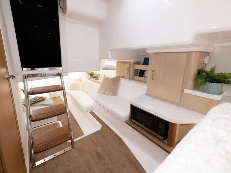 Slide: The Image of Top view of 2024 Regal 36 XO boat layout with dual outboard engines. - 12