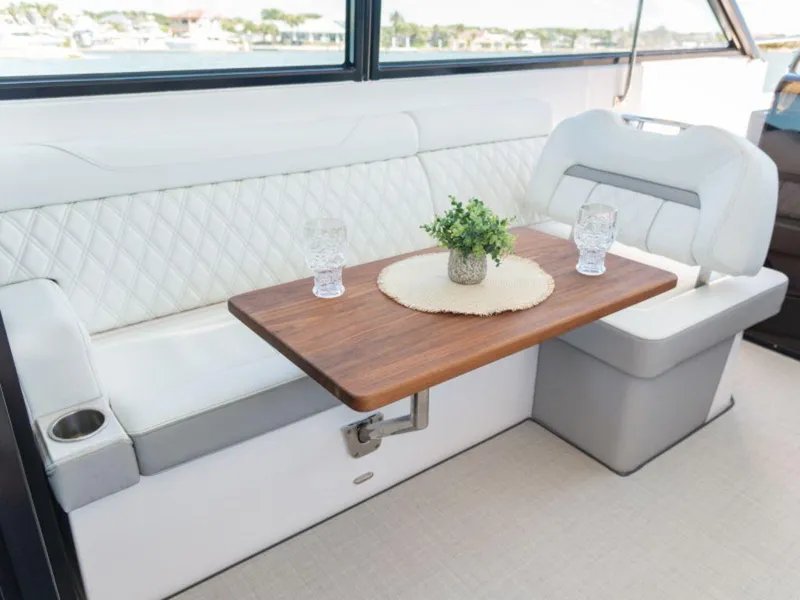 Slide: The Image of 2024 Regal 36 XO boat with spacious white seating area. - 13