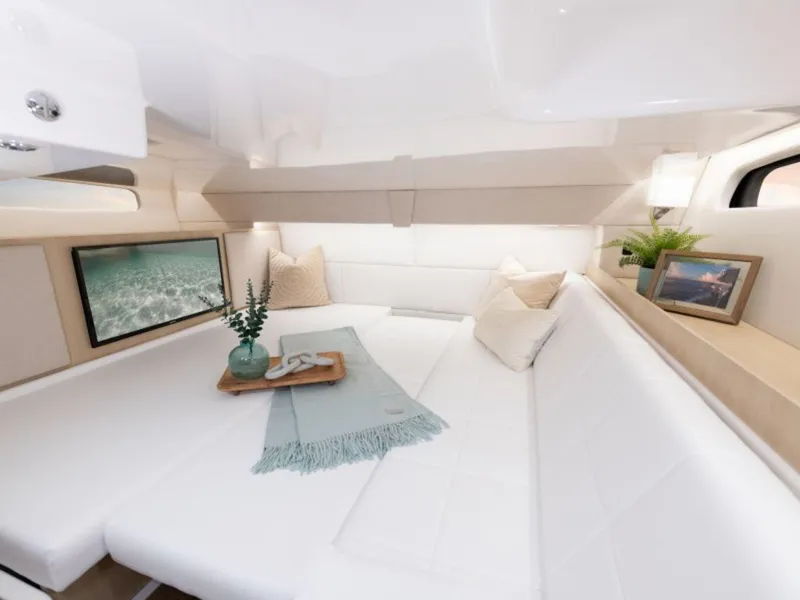 Slide: The Image of 2024 Regal 36 XO yacht interior with sleek white cabinetry and modern amenities. - 14