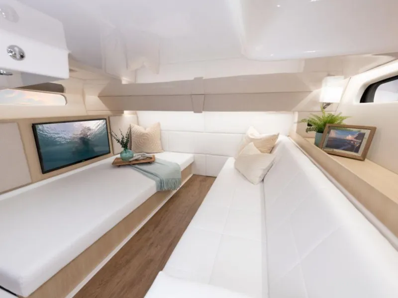 Slide: The Image of Luxurious interior of 2024 Regal 36 XO yacht with modern decor and comfortable seating. - 21