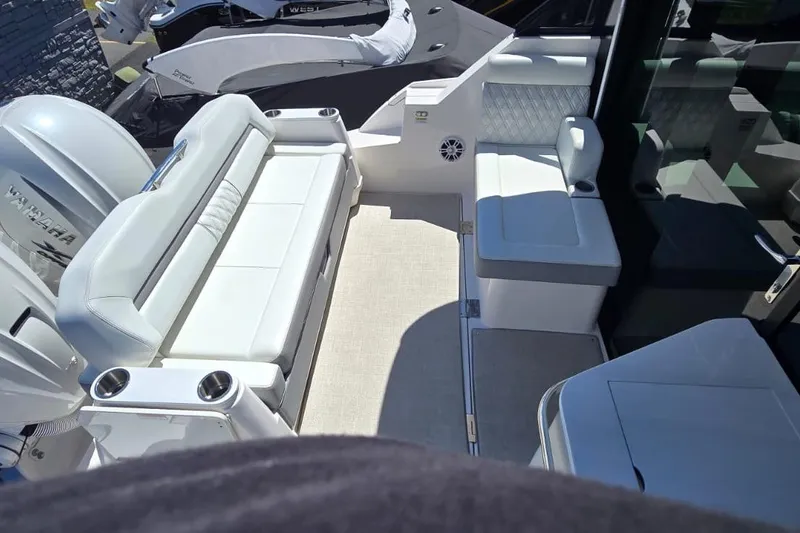 Slide: The Image of 2024 Regal 36 XO boat interior with white seating and modern design. - 26