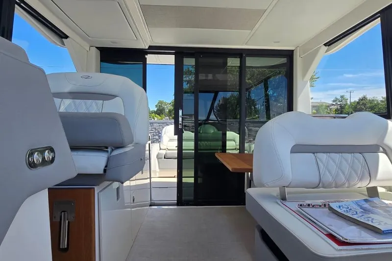Slide: The Image of 2024 Regal 36 XO yacht interior with luxurious seating and modern design. - 34