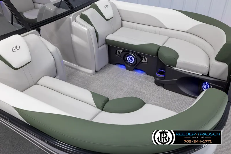 Slide: The Image of 2024 Avalon LSZ ELW boat interior with green and white seating, blue LED lighting. - 10