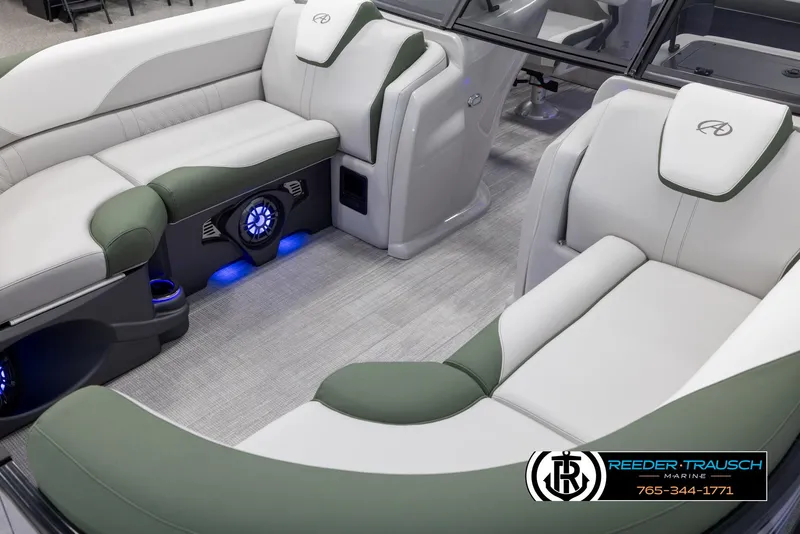Slide: The Image of 2024 Avalon LSZ ELW boat interior with luxurious seating and blue LED lighting. - 11