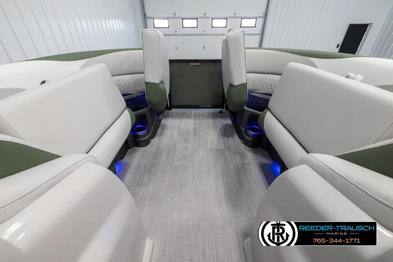 Slide: The Image of 2024 Avalon LSZ ELW boat interior with plush seating and blue LED lighting. - 20