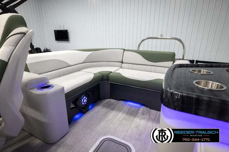 Slide: The Image of 2024 Avalon LSZ ELW boat interior with LED lighting and luxury seating. - 24