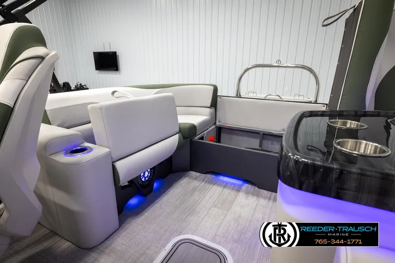Slide: The Image of 2024 Avalon LSZ ELW boat interior with modern seating and blue LED lighting. - 25