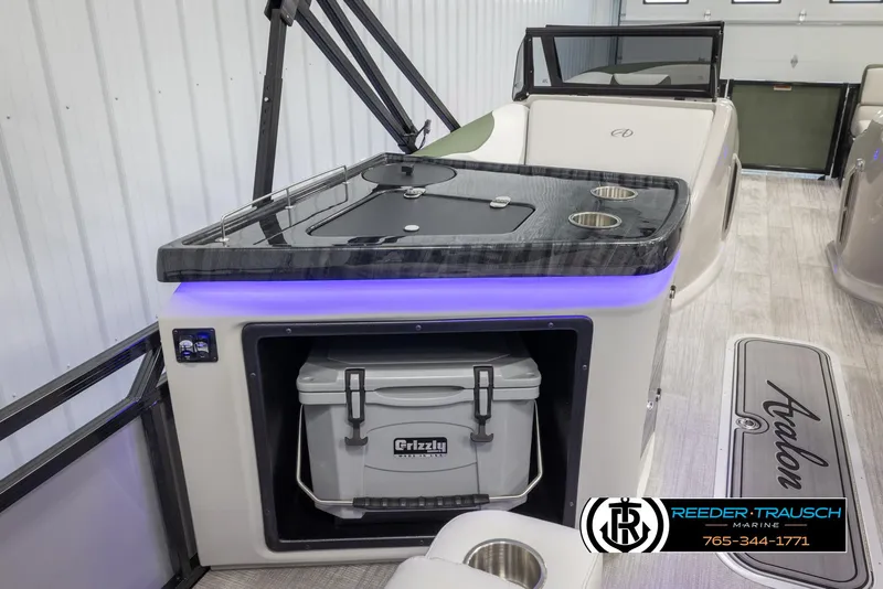 Slide: The Image of 2024 Avalon LSZ ELW boat interior with cooler and countertop. - 26