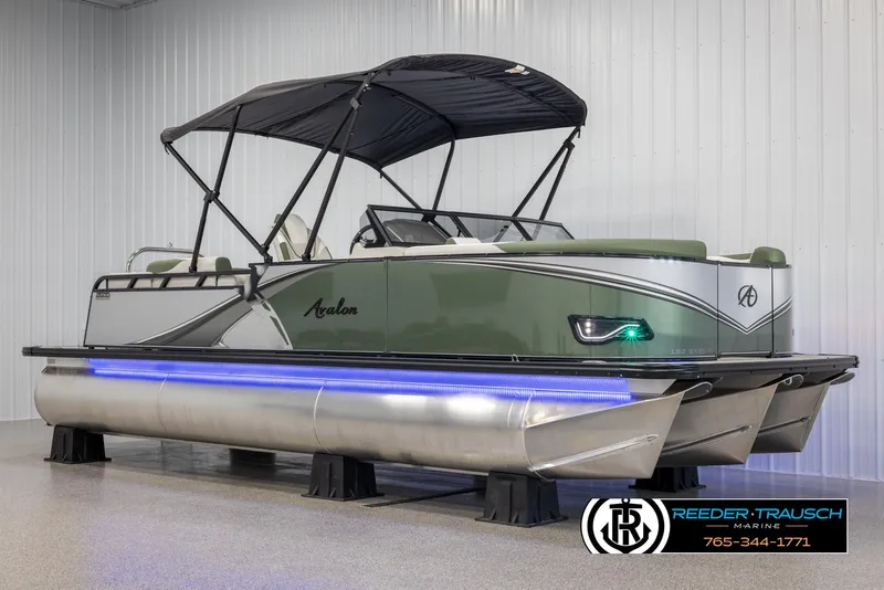 Slide: The Image of 2024 Avalon LSZ ELW pontoon boat with canopy and LED lighting in showroom. - 3
