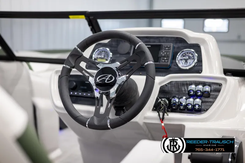 Slide: The Image of 2024 Avalon LSZ ELW boat dashboard with steering wheel and control panel. - 31