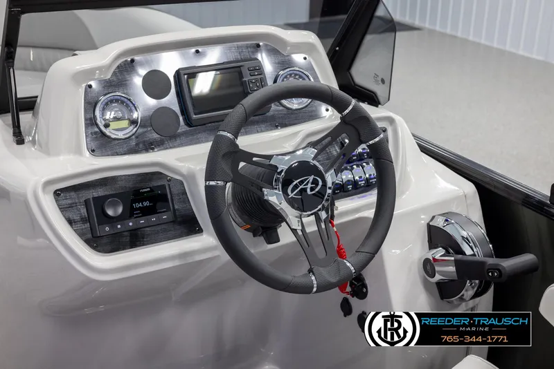 Slide: The Image of 2024 Avalon LSZ ELW boat dashboard with steering wheel and control panel. - 33