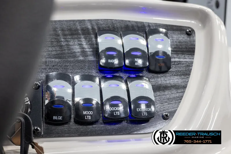 Slide: The Image of Control panel of 2024 Avalon LSZ ELW boat with illuminated switches for various functions. - 39
