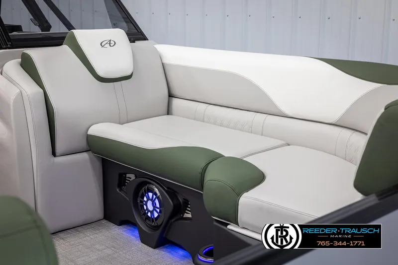 Slide: The Image of 2024 Avalon LSZ ELW boat interior with green and white seating, blue LED lighting. - 41