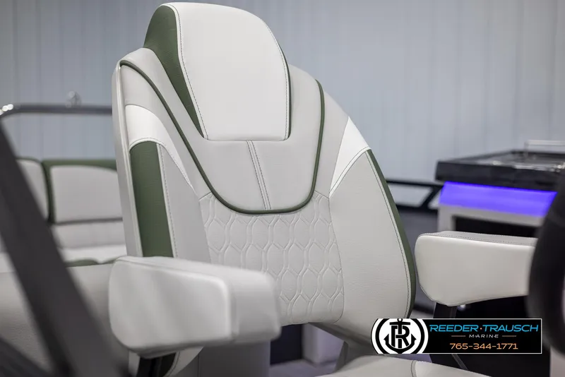 Slide: The Image of 2024 Avalon LSZ ELW boat seat with white and green upholstery. - 42