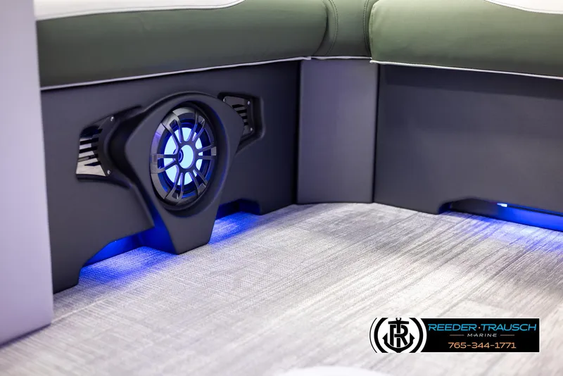 Slide: The Image of 2024 Avalon LSZ ELW boat interior with LED-lit speaker and cushioned seating. - 44