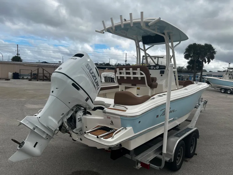 Slide: The Image of 2024 Pioneer 202 Islander boat with Suzuki outboard motor on trailer. - 3