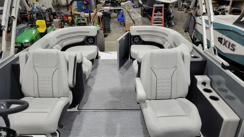 Slide: The Image of 2024 Hurricane Fundeck 2360 SBC OB boat interior with plush seating and modern design. - 7