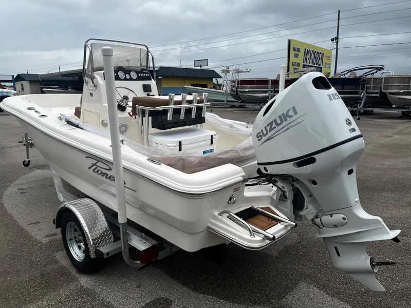 Slide: The Image of 2024 Pioneer 180 Sportfish boat with Suzuki outboard motor on trailer. - 3