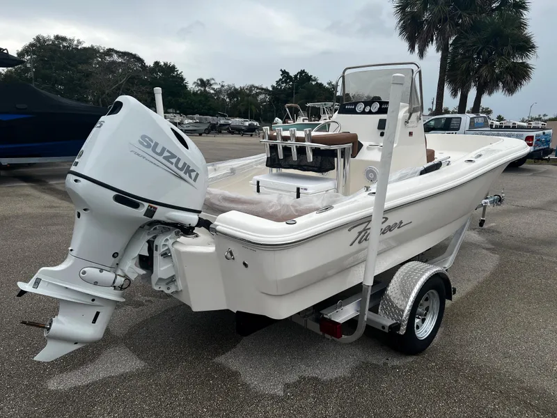 Slide: The Image of 2024 Pioneer 180 Sportfish boat with Suzuki outboard motor on trailer. - 4