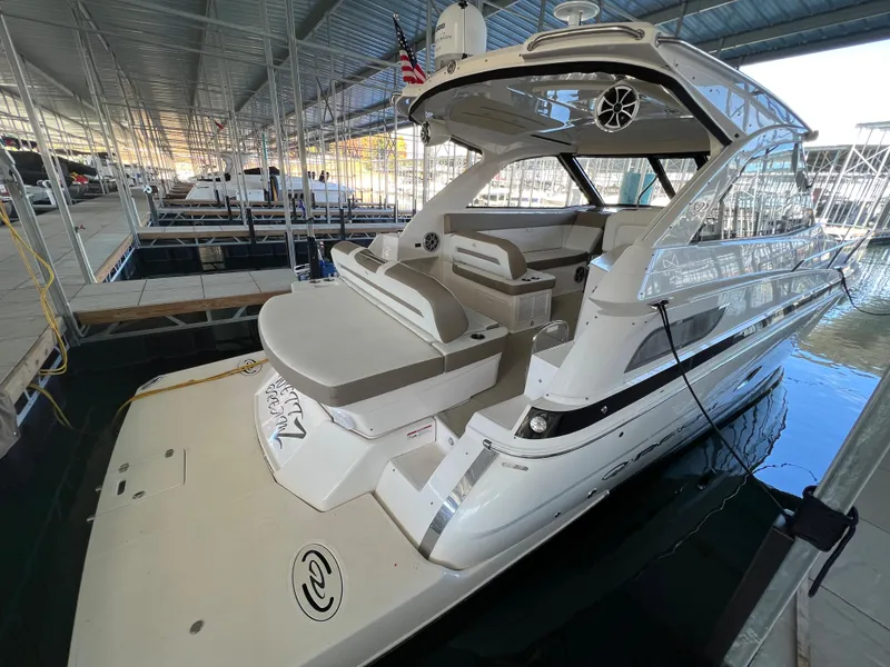 Slide: The Image of 2017 Regal 35 Sport Coupe docked in a covered marina. - 1