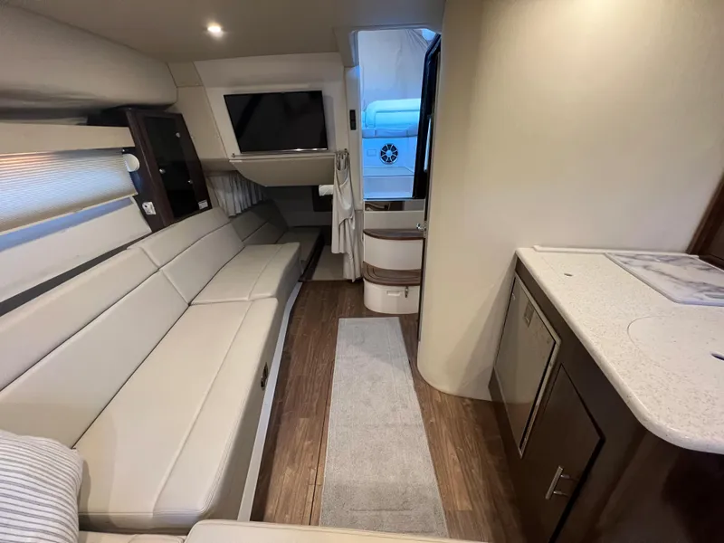 Slide: The Image of Interior of 2017 Regal 35 Sport Coupe with modern seating and kitchenette. - 10