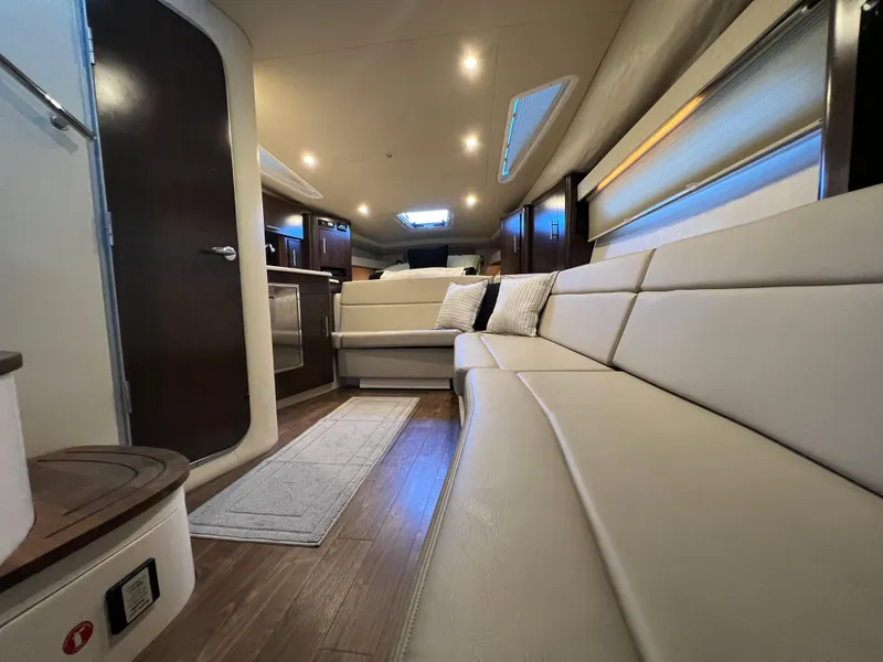 Slide: The Image of 2017 Regal 35 Sport Coupe interior with beige leather seating and modern amenities. - 14