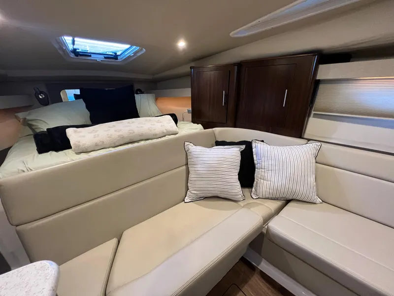 Slide: The Image of Cozy cabin interior of 2017 Regal 35 Sport Coupe with bed and skylight. - 19