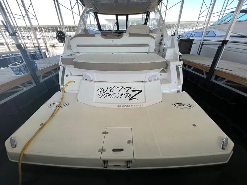 Slide: The Image of 2017 Regal 35 Sport Coupe docked in a covered marina. - 2