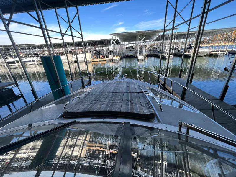 Slide: The Image of Interior of a 2017 Regal 35 Sport Coupe boat with seating and helm. - 4