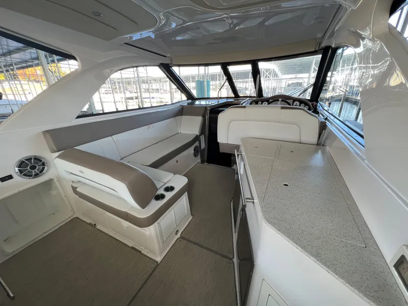 Slide: The Image of Interior of a 2017 Regal 35 Sport Coupe yacht with seating and kitchenette. - 6