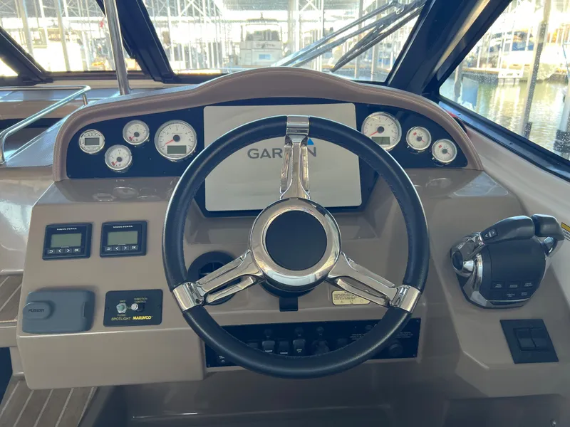 Slide: The Image of 2017 Regal 35 Sport Coupe helm with Garmin navigation system. - 8