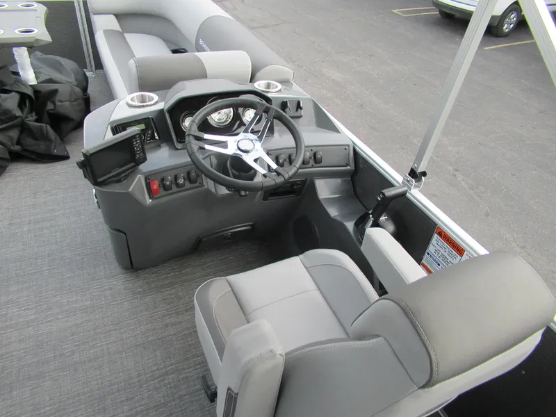 Slide: The Image of 2024 Bennington 20 SVSR boat interior with steering console and seating. - 5