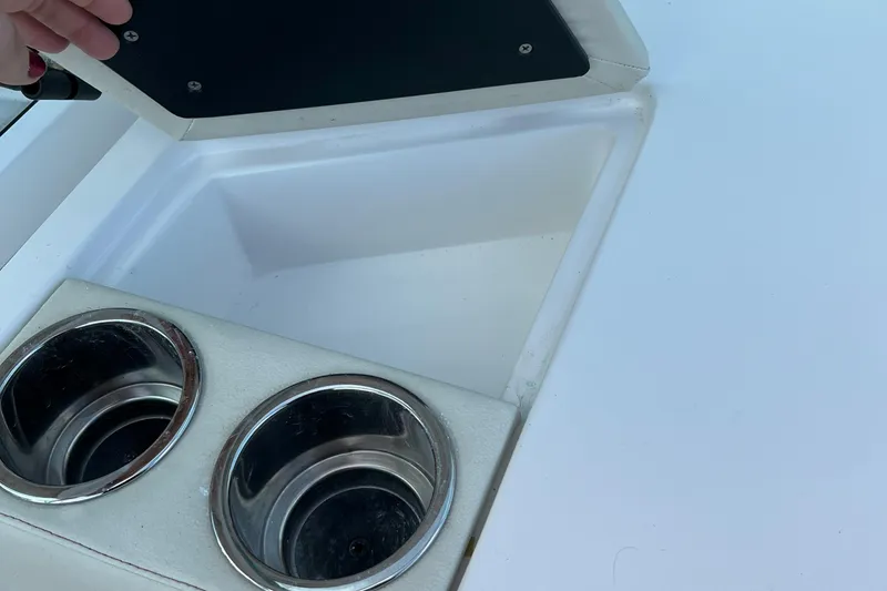 Slide: The Image of 2015 Hunt Yachts Harrier Sport boat with built-in cup holders and storage compartment. - 13