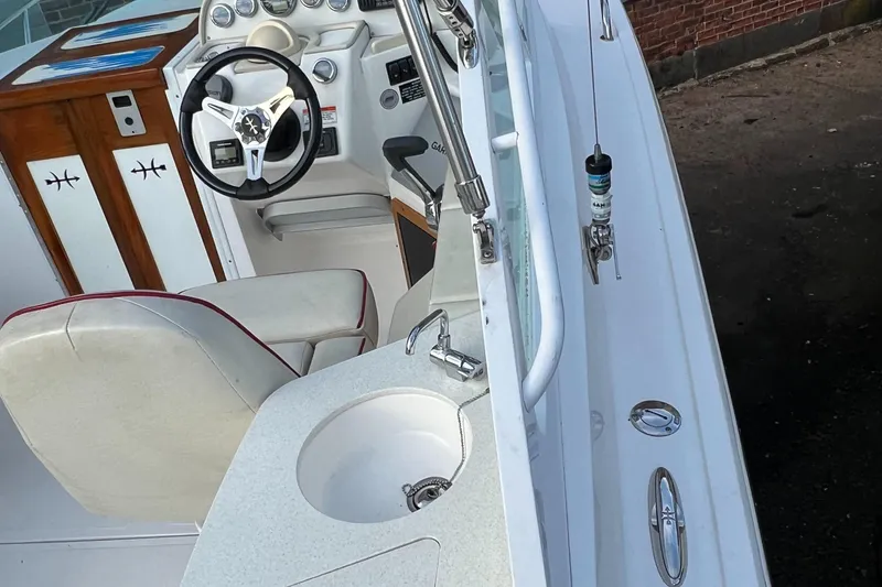 Slide: The Image of 2015 Hunt Yachts Harrier Sport interior with steering wheel and seating. - 2