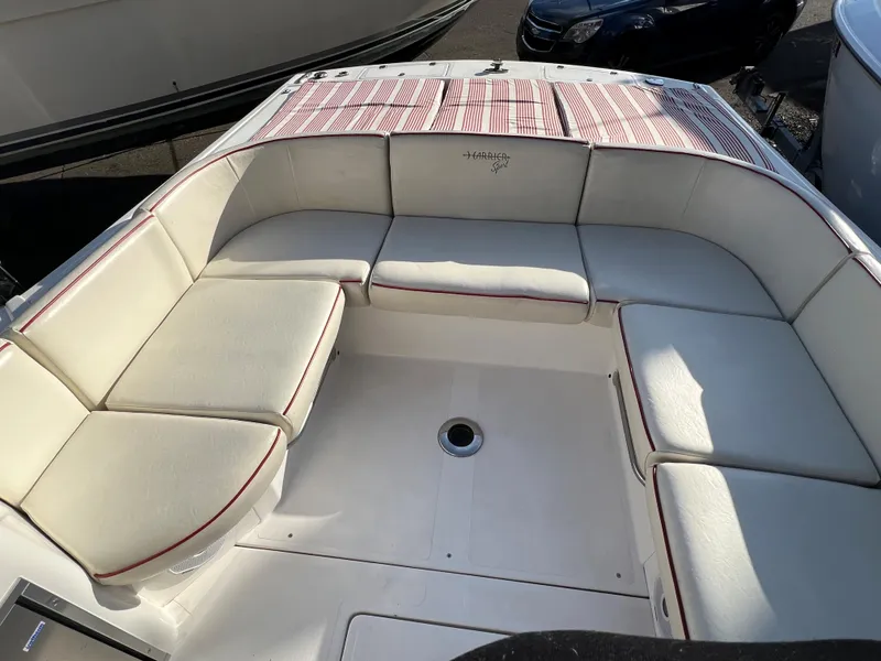 Slide: The Image of 2015 Hunt Yachts Harrier Sport boat with spacious white seating area. - 4