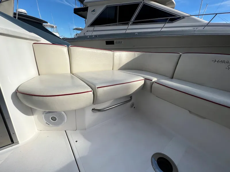 Slide: The Image of 2015 Hunt Yachts Harrier Sport boat with white cushioned seating area. - 6