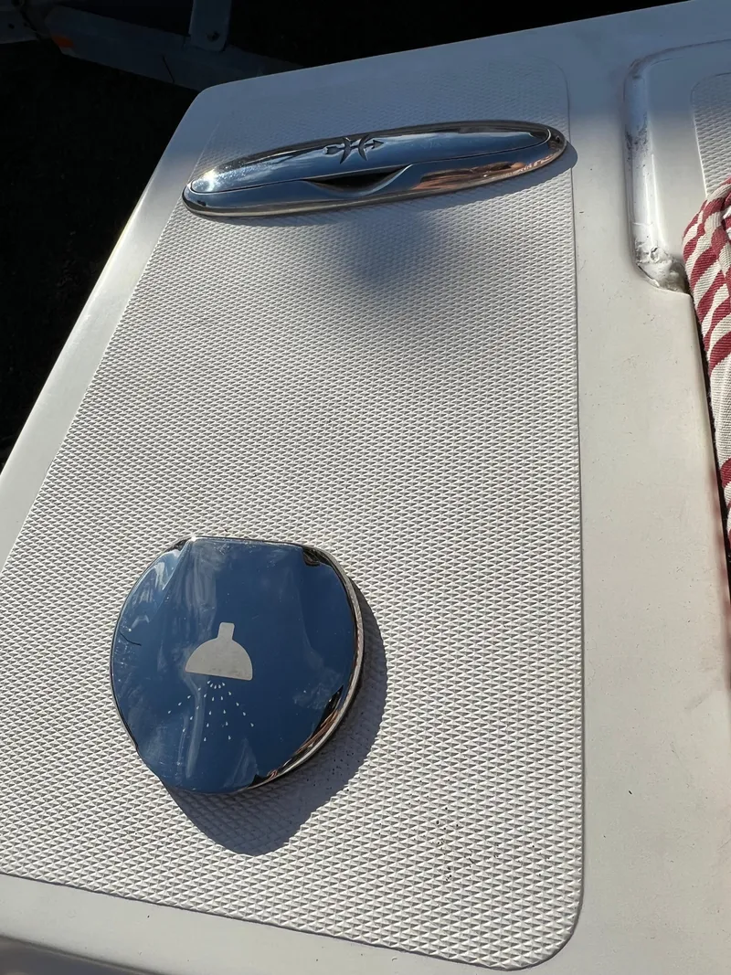 Slide: The Image of 2015 Hunt Yachts Harrier Sport deck with chrome fixtures and textured surface. - 9