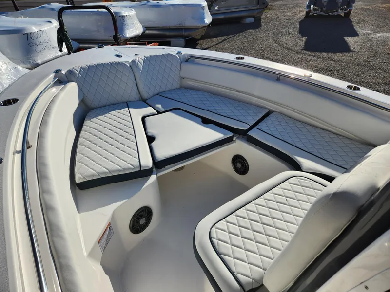 Slide: The Image of 2024 Sea Fox 248 Side Console boat with cushioned seating and storage compartments. - 4