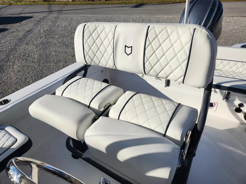 Slide: The Image of 2024 Sea Fox 248 Side Console boat with white quilted seats. - 6