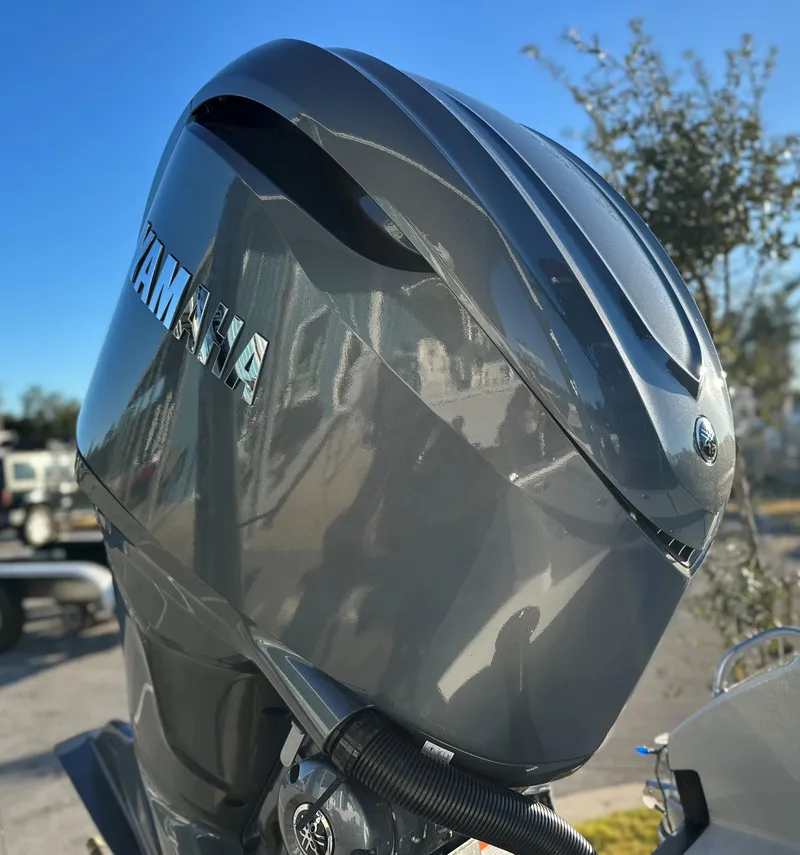 Slide: The Image of Yamaha outboard motor on 2025 Pathfinder 2500 Hybrid boat, sunny day. - 12