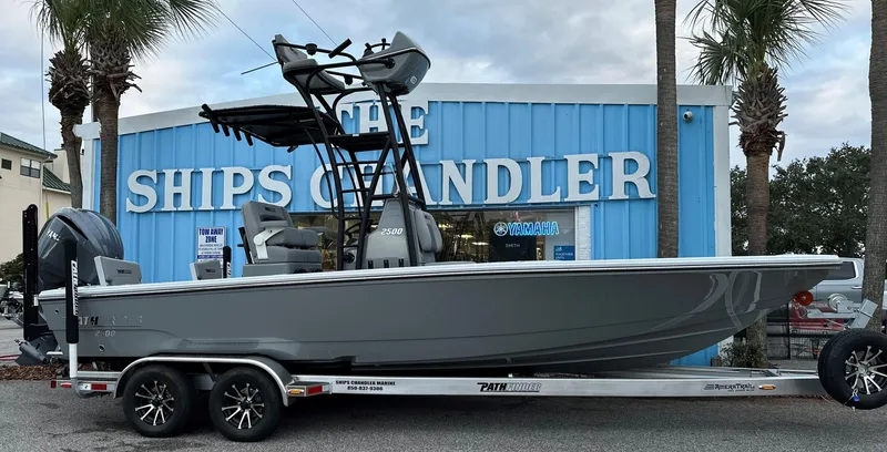 Slide: The Image of 2024 Pathfinder 2500 Hybrid boat on trailer outside The Ships Chandler. - 3